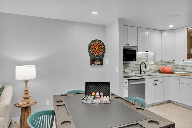 a kitchen with a sink cabinets and a wooden floor