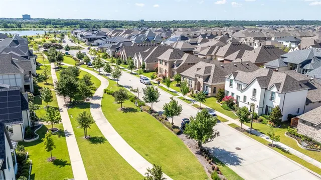 a view of multiple houses with a yard