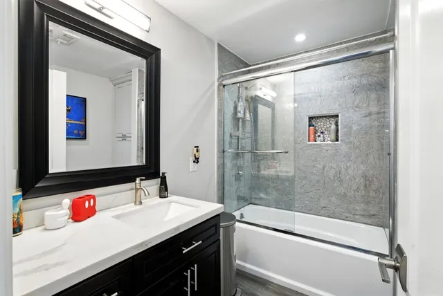 a bathroom with a sink and a mirror