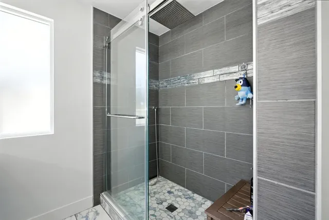 a kitchen with a sink and a refrigerator