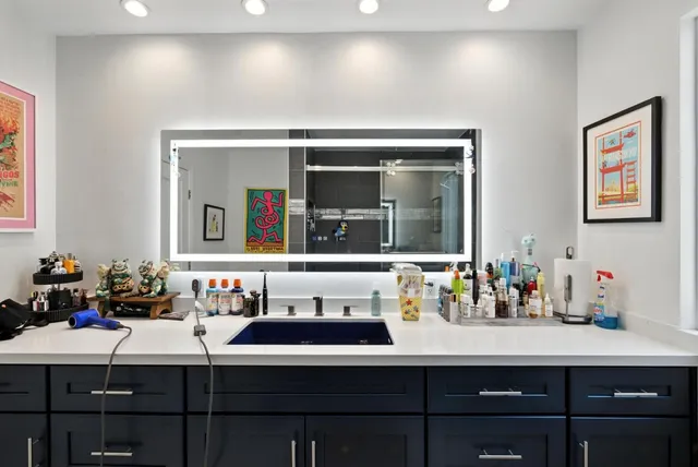 a bathroom with a sink and a mirror
