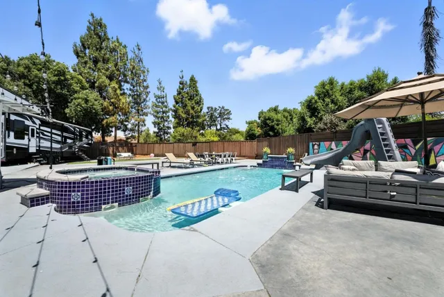 an aerial view of a house with swimming pool
