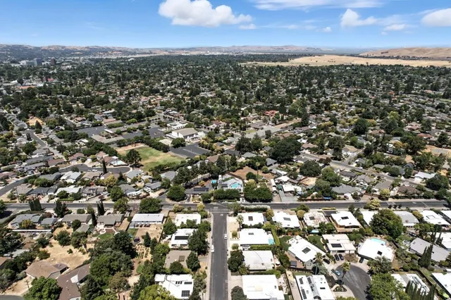 a view of street with parked cars