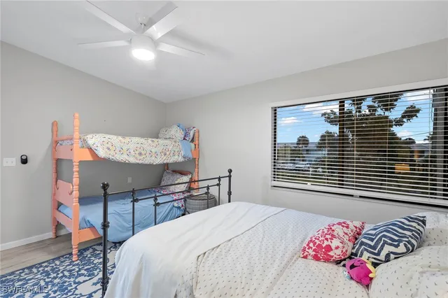 a bathroom with a sink a toilet a mirror and vanity