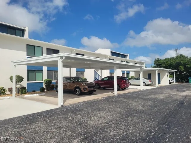 a view of a car park in front of house