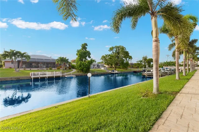 a view of a swimming pool with a table and chairs