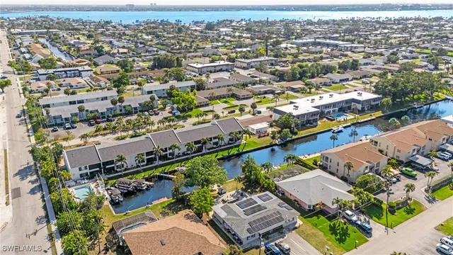an aerial view of a city with streets and houses