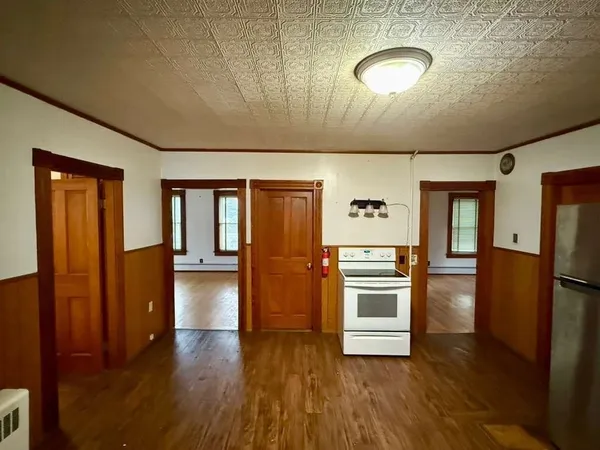 a kitchen with stainless steel appliances granite countertop a refrigerator and a stove top oven