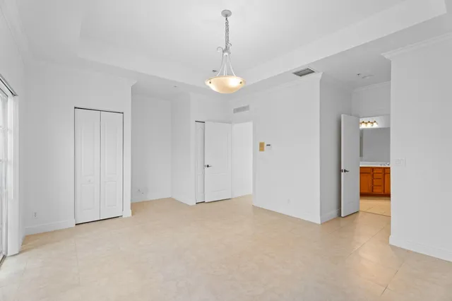 a bathroom with a double vanity sink a mirror and a bathtub