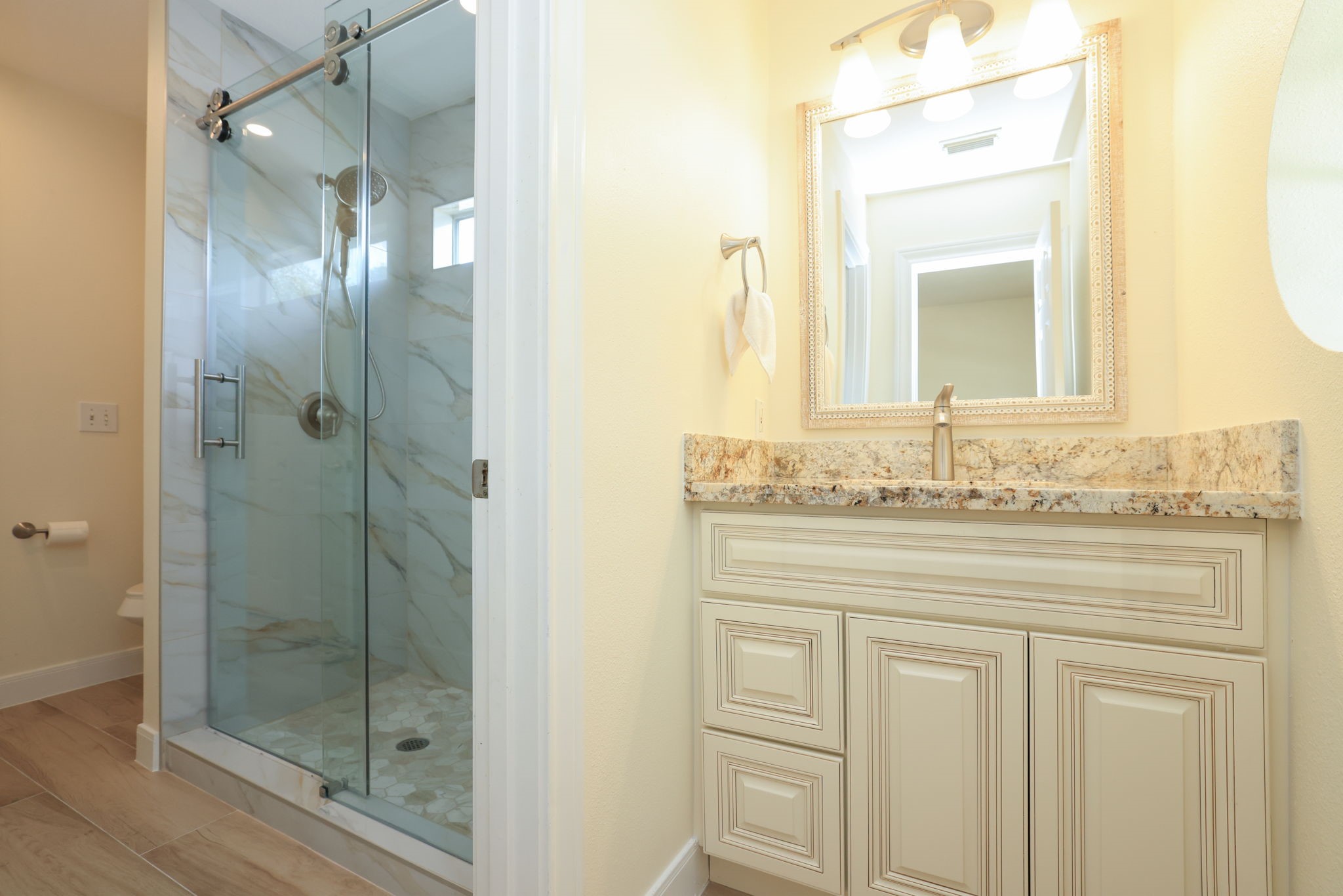 3711 Sapling Trail Court Spring, TX 77388 - Photo 32 of 50 a bathroom with a shower sink and mirror