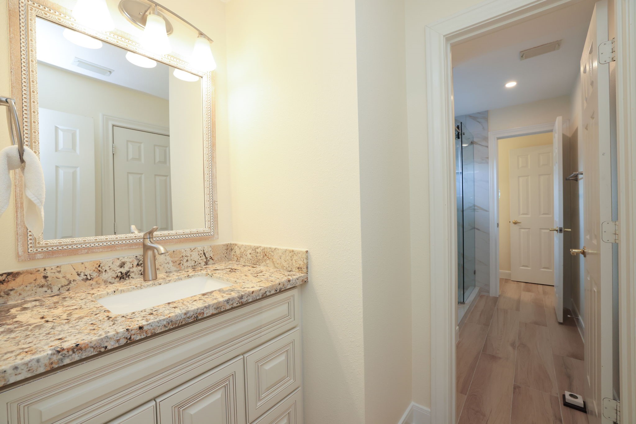 3711 Sapling Trail Court Spring, TX 77388 - Photo 36 of 50 a bathroom with a granite countertop sink and a mirror