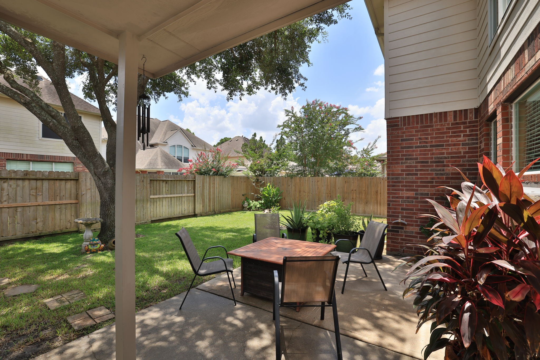 3711 Sapling Trail Court Spring, TX 77388 - Photo 40 of 50 a view of a chairs and table in backyard of the house