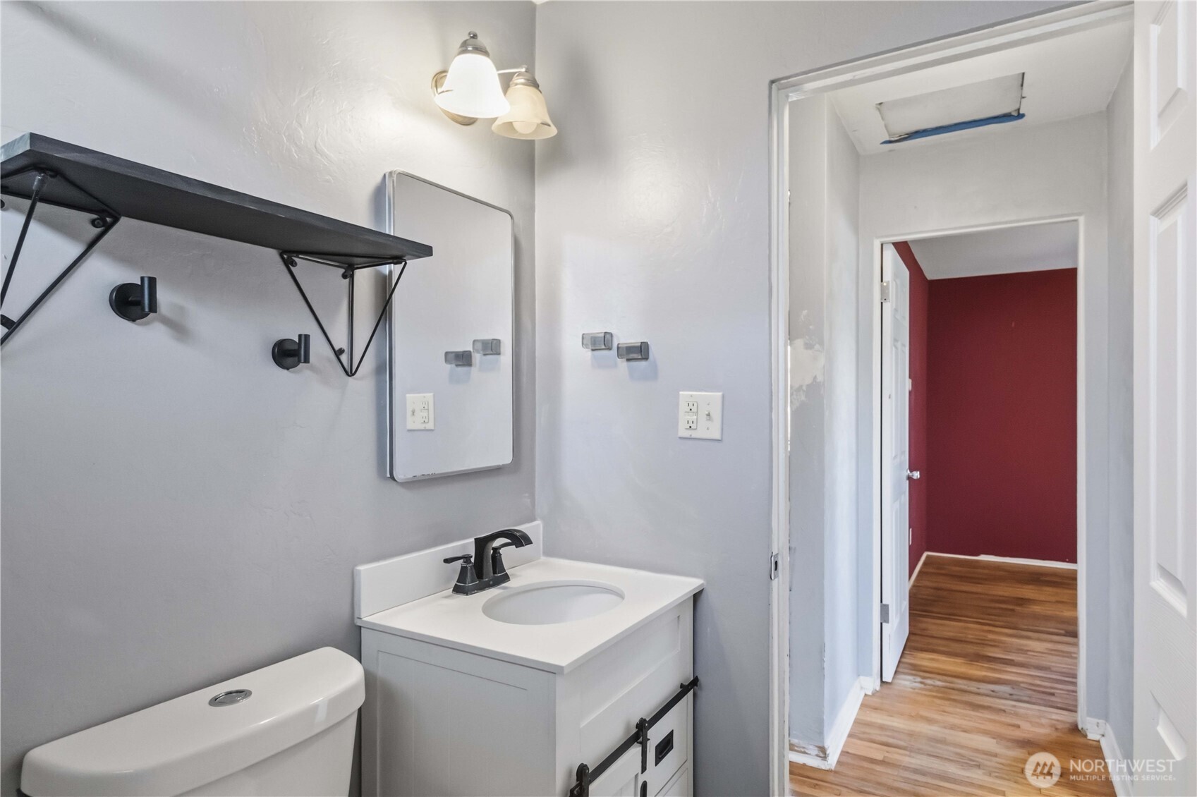 356 28th Avenue Longview, WA 98632 - Photo 17 of 24 a bathroom with a sink a toilet and a mirror
