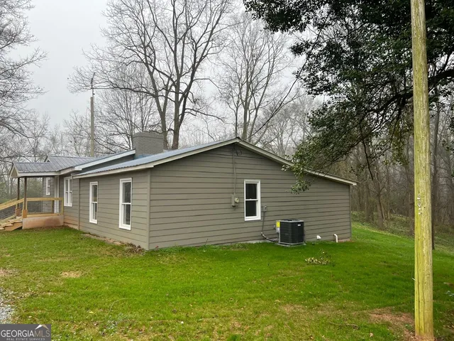 a backyard of a house with seating space