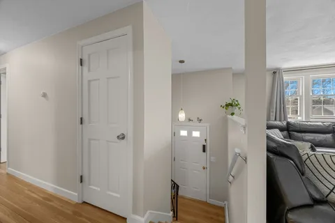 wooden floor with white walls
