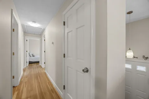 a view of a bathroom from a hallway