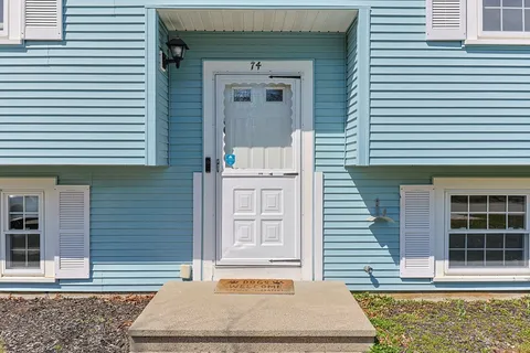 a front view of a house with a garage
