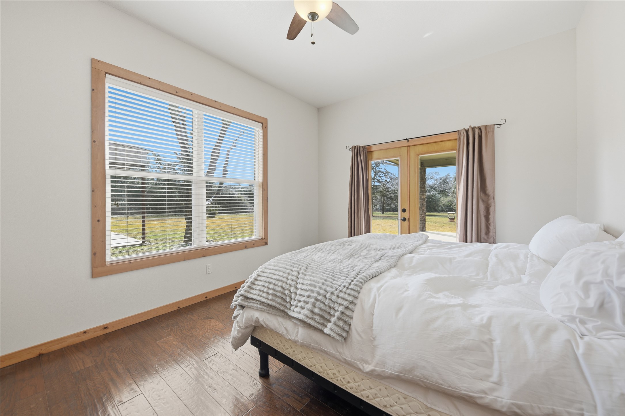 12218 Frantz Road Cat Spring, TX 78933 - Photo 11 of 25 a bedroom with a bed and window