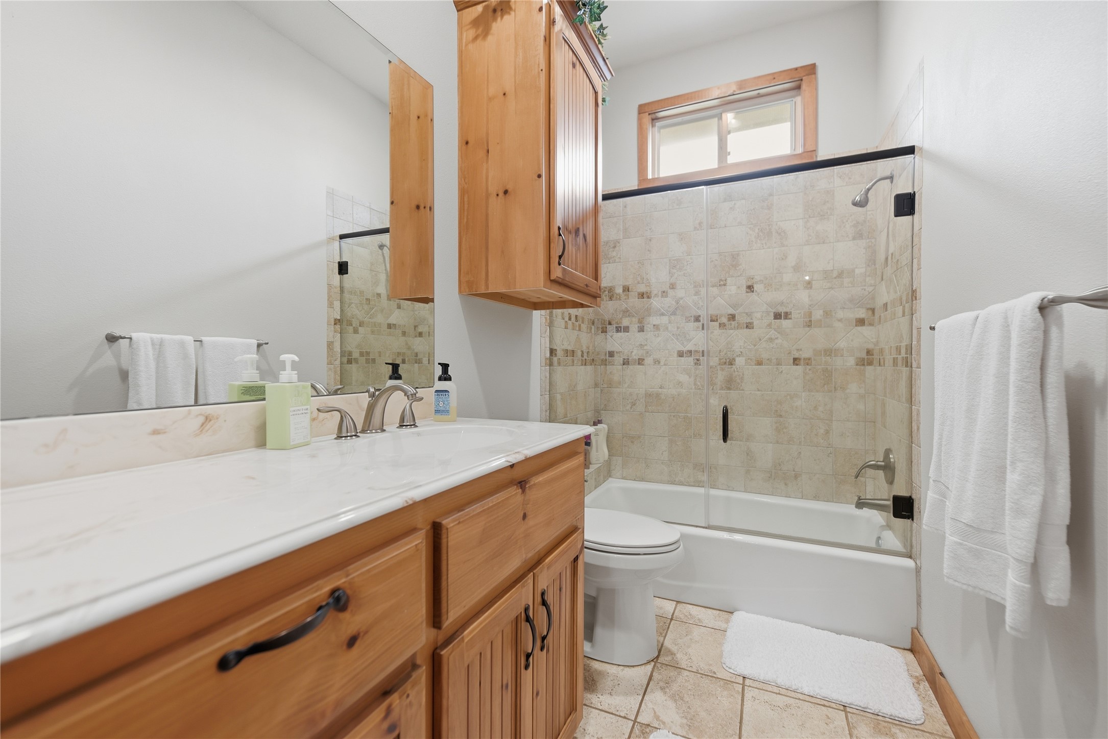12218 Frantz Road Cat Spring, TX 78933 - Photo 12 of 25 a bathroom with a granite countertop sink toilet and shower