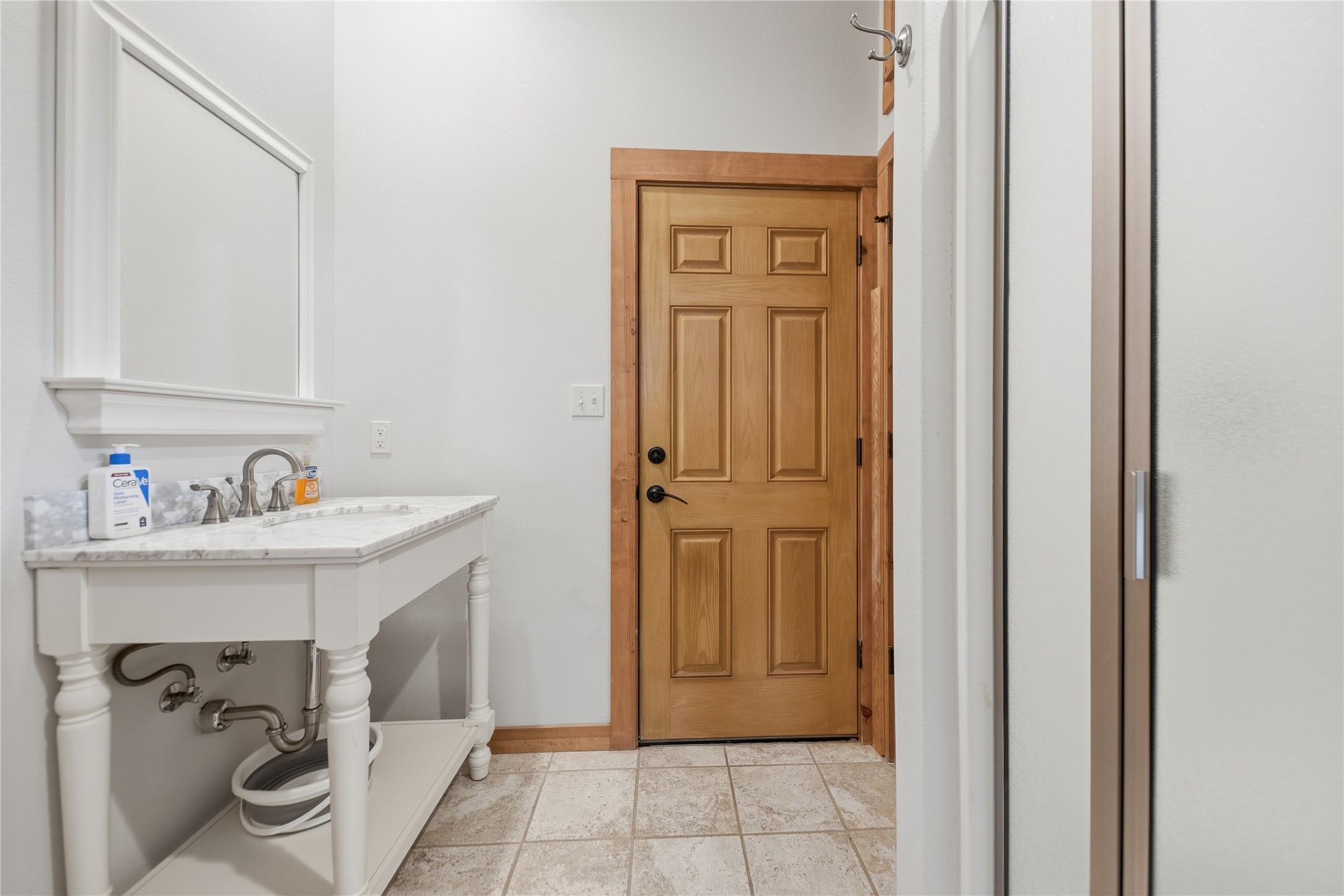 12218 Frantz Road Cat Spring, TX 78933 - Photo 13 of 25 a bathroom with a sink and washing machine