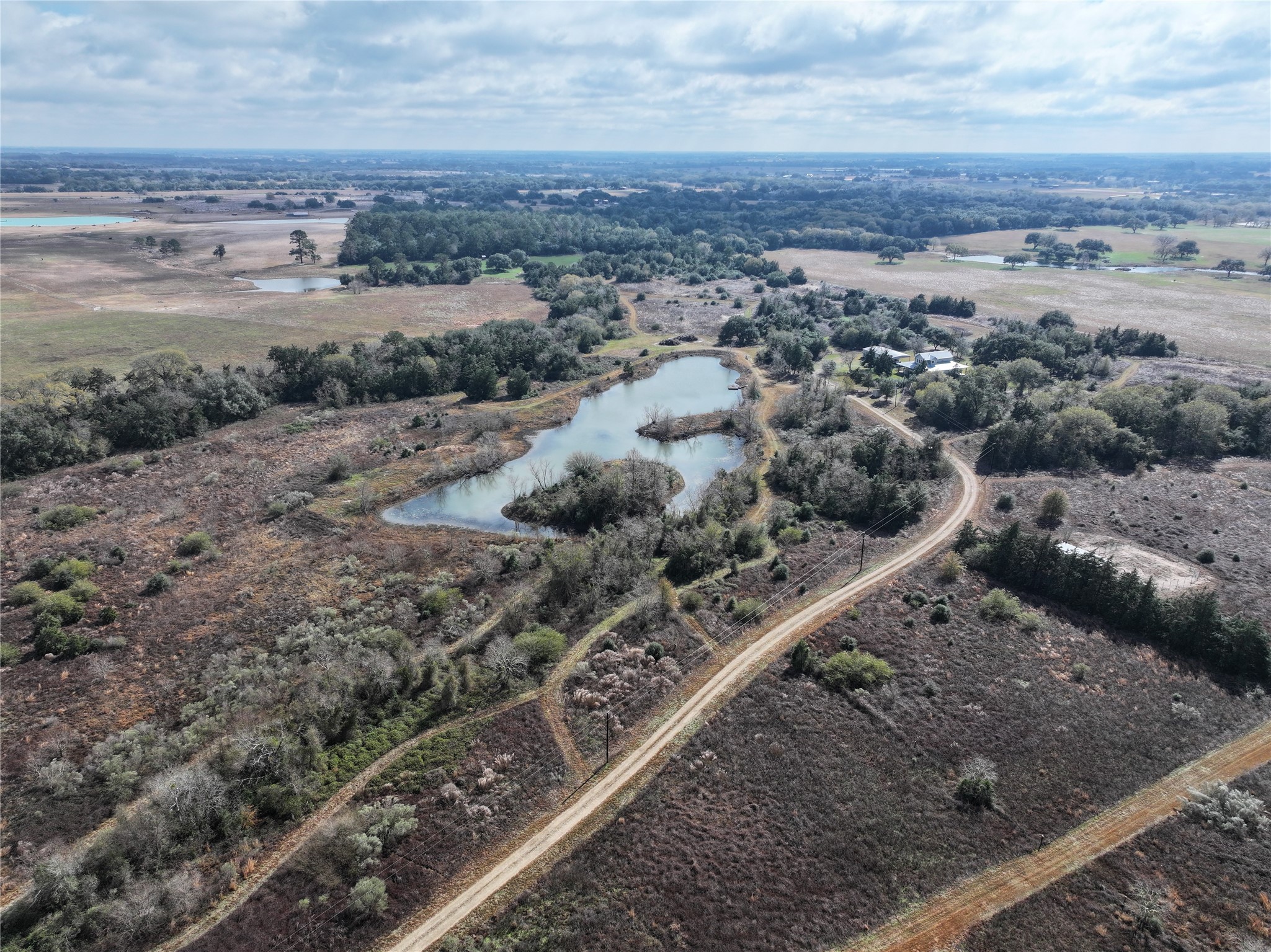 12218 Frantz Road Cat Spring, TX 78933 - Photo 17 of 25 an aerial view of a house with a yard and ocean