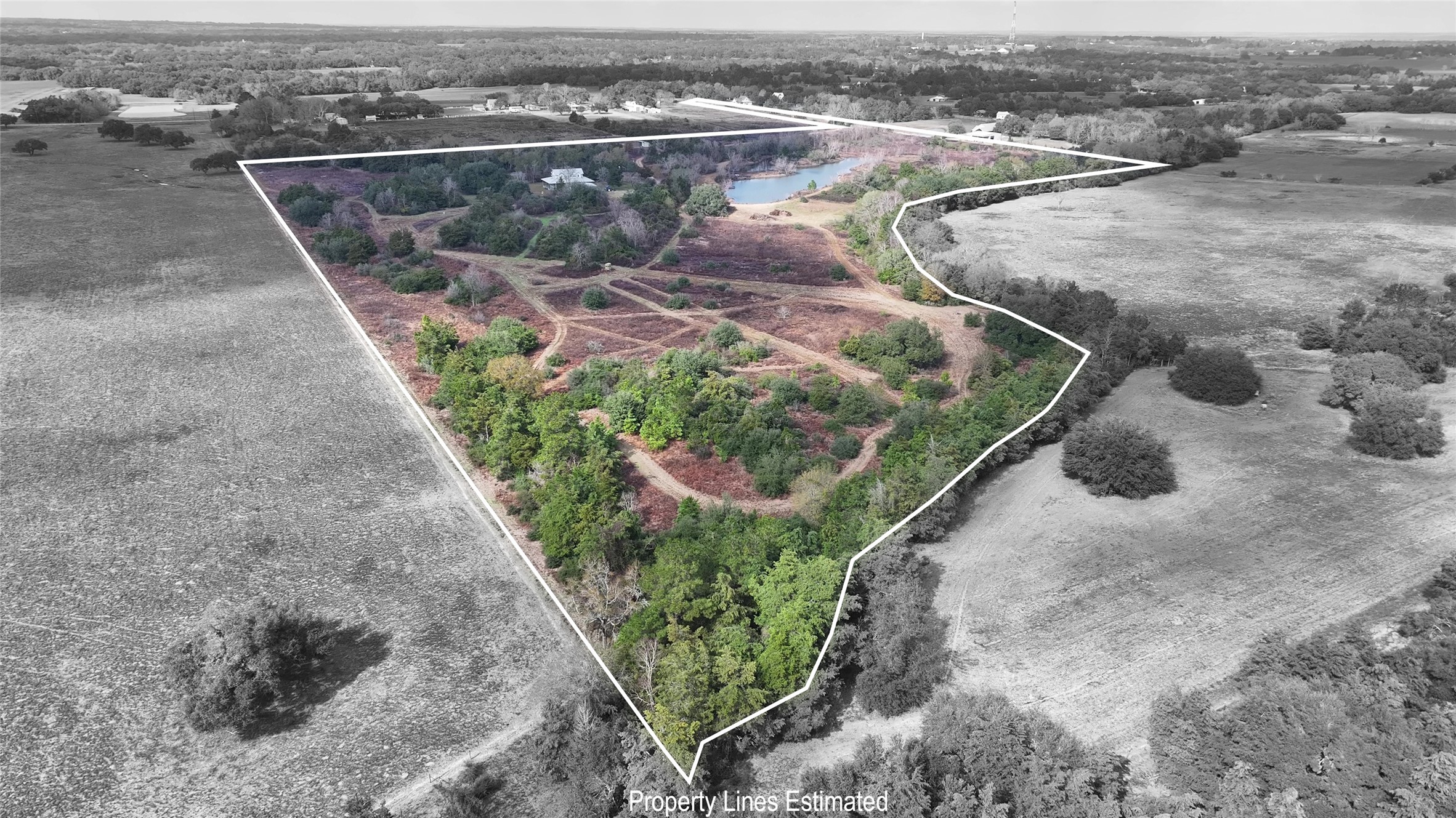 12218 Frantz Road Cat Spring, TX 78933 - Photo 2 of 25 an aerial view of a house with a yard and lake view