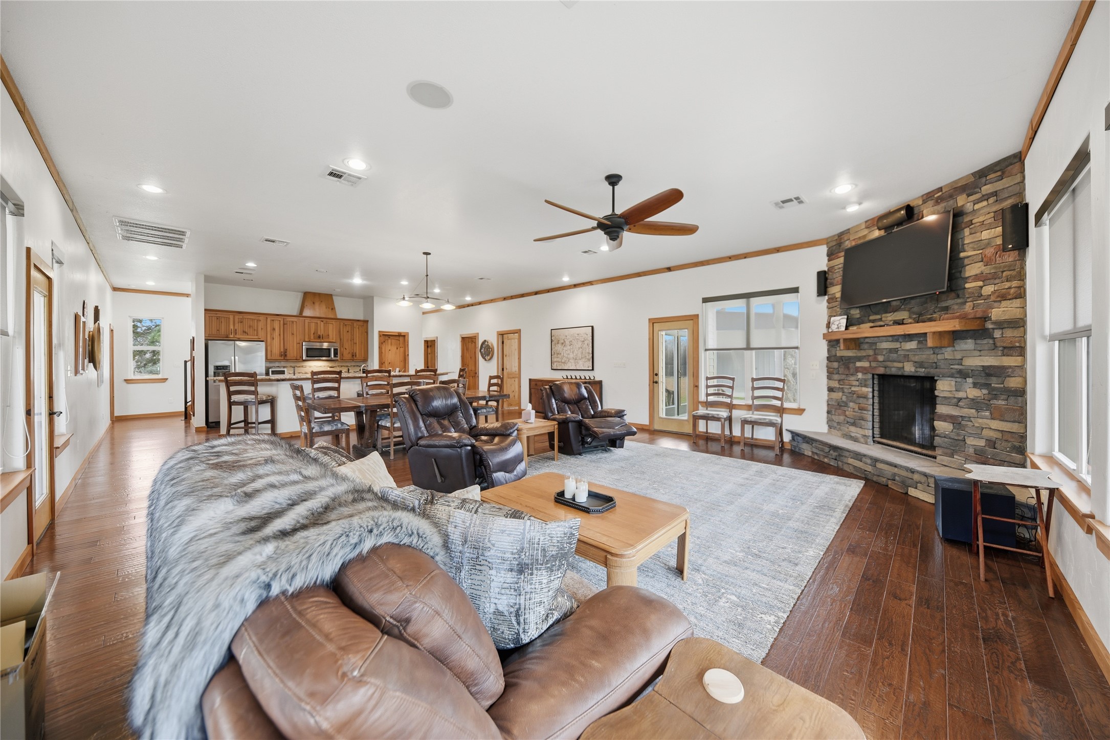 12218 Frantz Road Cat Spring, TX 78933 - Photo 5 of 25 a living room with furniture fireplace and a wooden floor