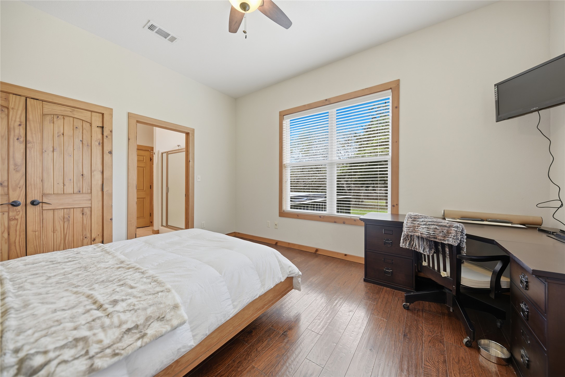 12218 Frantz Road Cat Spring, TX 78933 - Photo 10 of 25 a bed room with a bed and a window