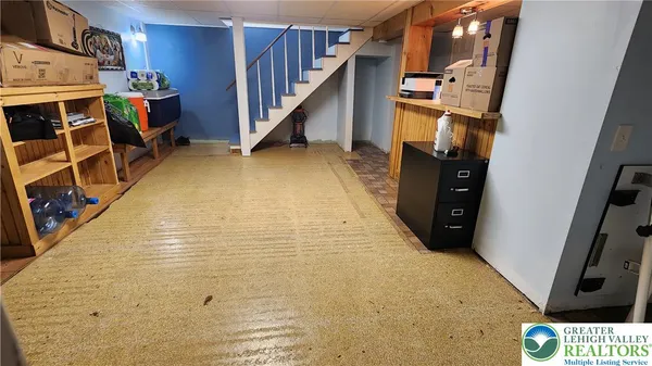 a view of an empty room with stairs