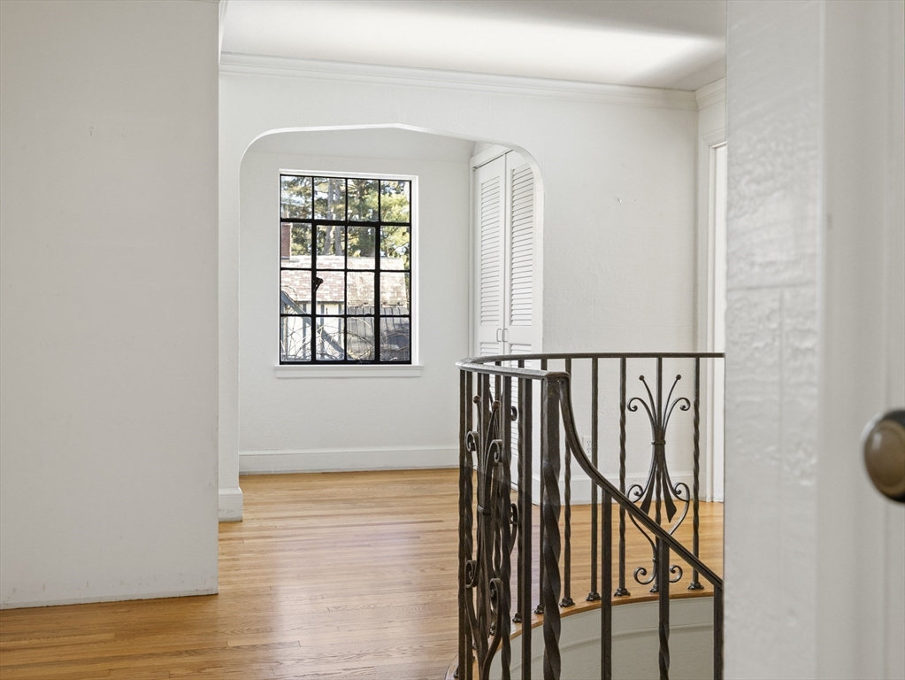 110 Pickwick Road Newton, MA 02465 - Photo 15 of 27 an entryway with wooden floor and stairs