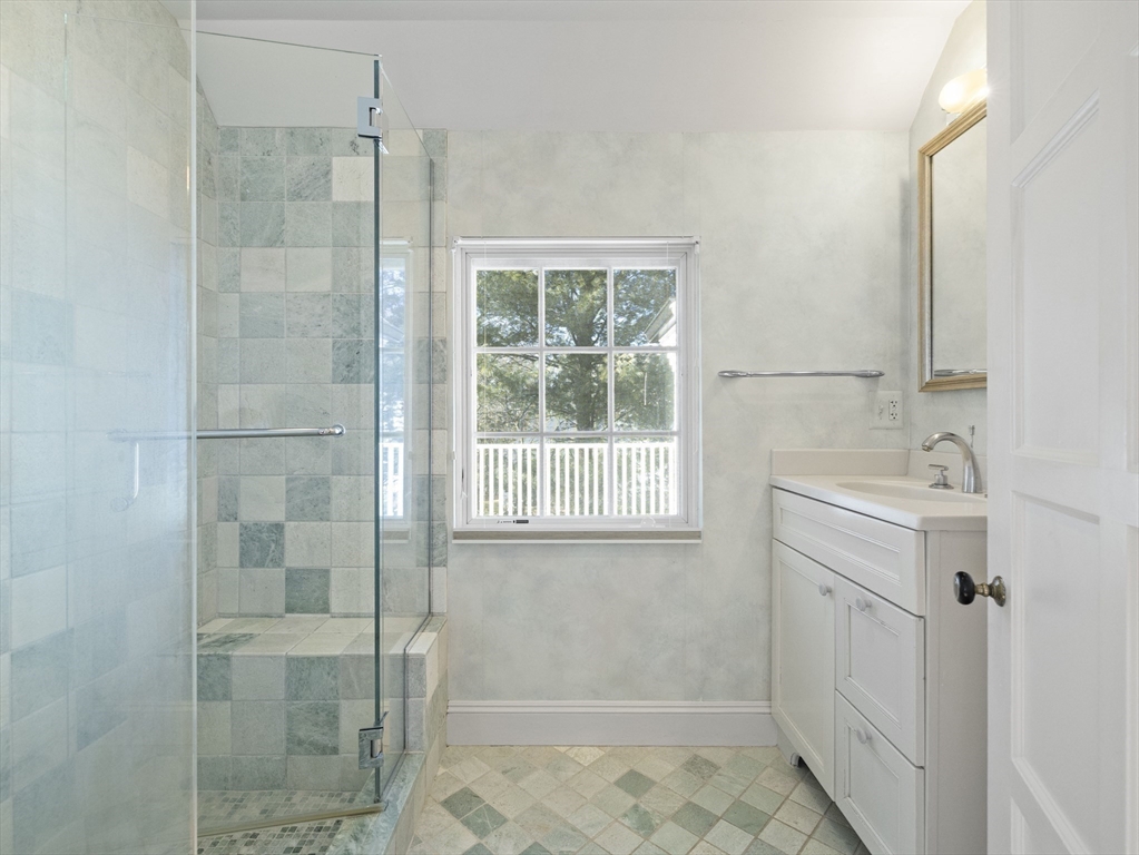 110 Pickwick Road Newton, MA 02465 - Photo 18 of 27 a bathroom with a sink a toilet and shower