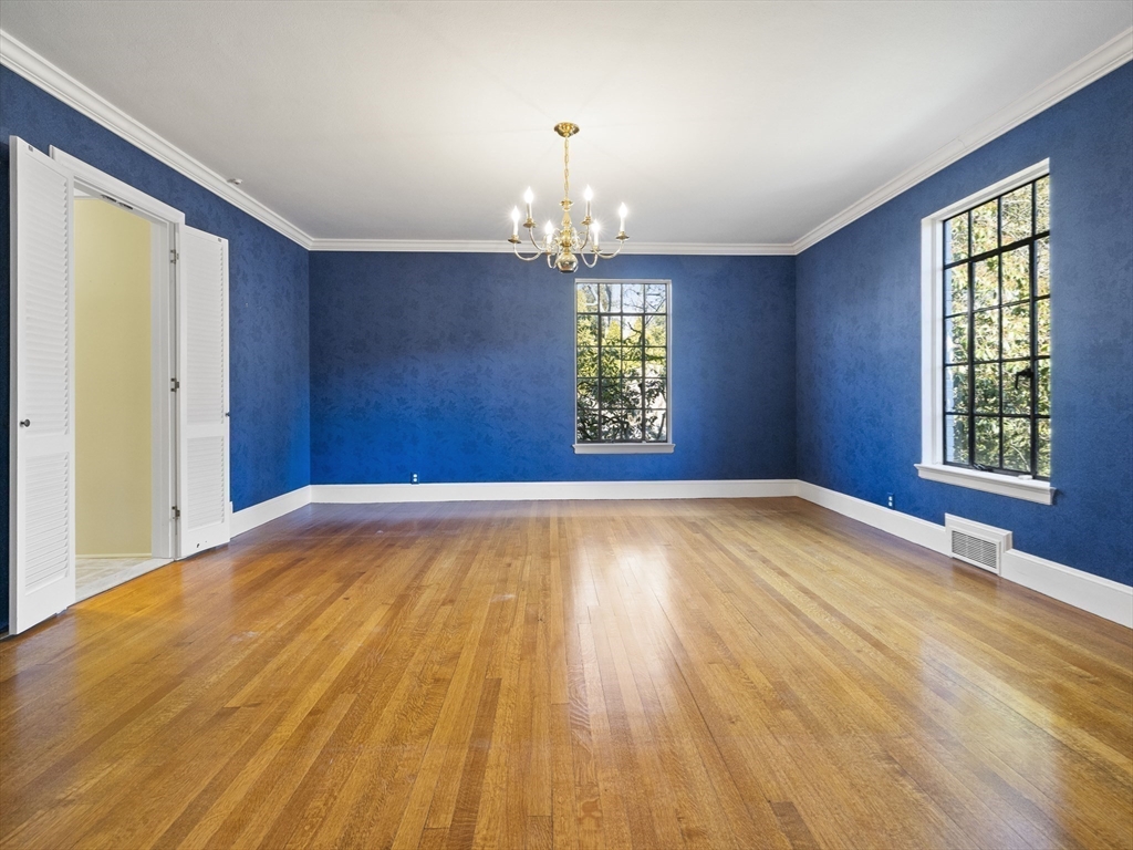 110 Pickwick Road Newton, MA 02465 - Photo 8 of 27 wooden floor in an empty room with a window