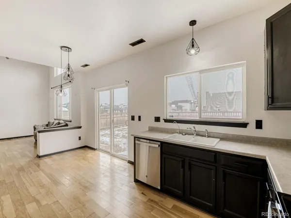 a spacious bathroom with a granite countertop sink mirror and bathtub