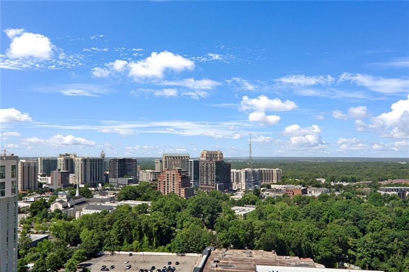 3325 Piedmont Road Northeast, Unit 2404 Atlanta, GA 30305 - Photo 25 of 36 a view of a city with lots of trees