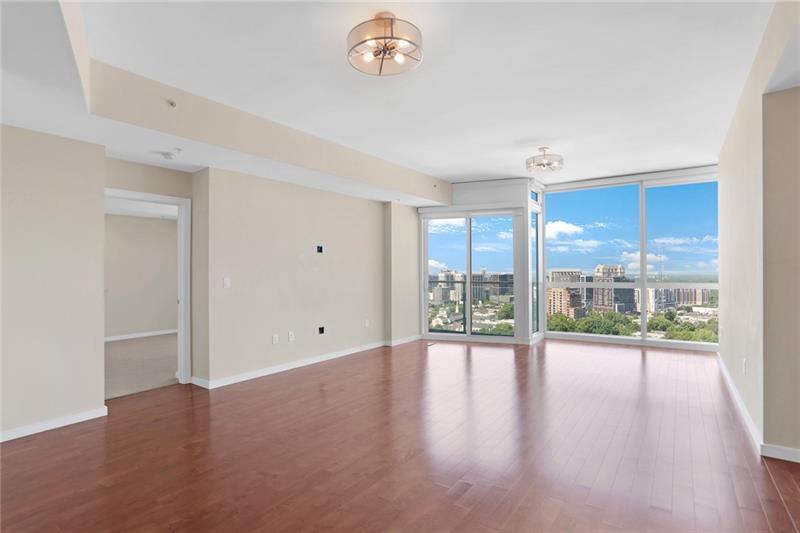 3325 Piedmont Road Northeast, Unit 2404 Atlanta, GA 30305 - Photo 5 of 36 wooden floor in an empty room with a window