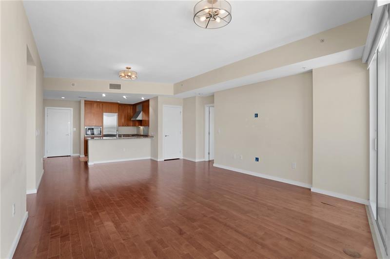 3325 Piedmont Road Northeast, Unit 2404 Atlanta, GA 30305 - Photo 8 of 36 a view of a kitchen with a sink and a refrigerator