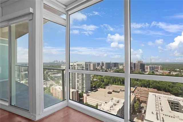 an empty room with sliding glass door and glass door