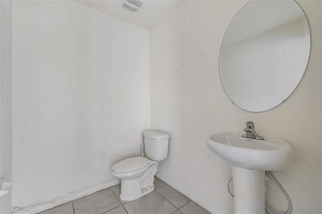 a view of a room with racks on the wall and a window