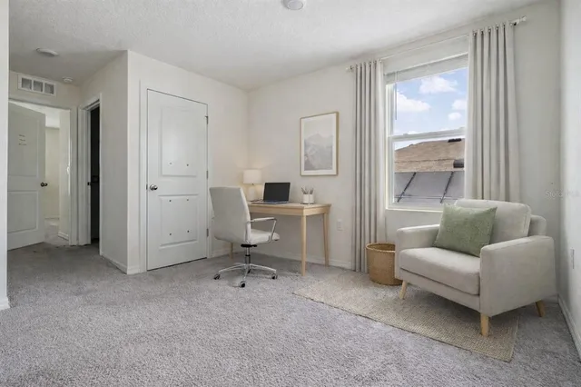 an aerial view of multiple houses with yard