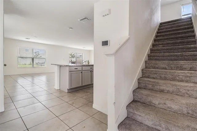 a kitchen with stainless steel appliances a stove top oven and cabinets