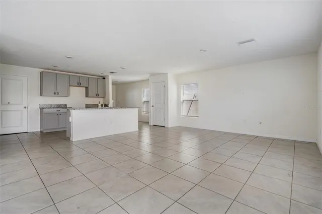 a view of a kitchen with a sink dishwasher and a refrigerator