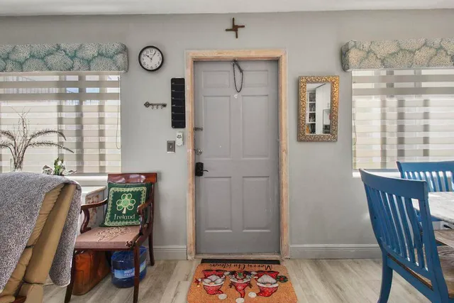 a view of a dining room with furniture and window