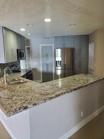 a view of a kitchen from a sink