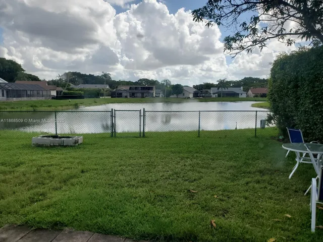 a view of a lake view with a big yard