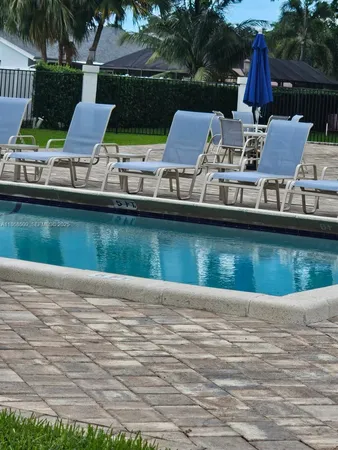 a view of a lake with furniture