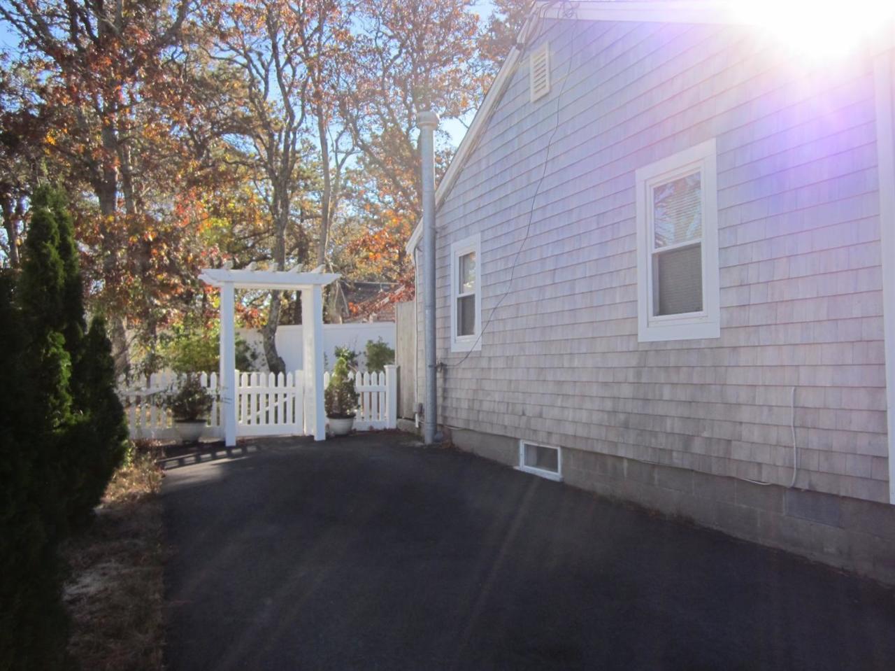 12 Captain Chase Road Dennis Port, MA 02639 - Photo 13 of 14 a view of a house with a yard