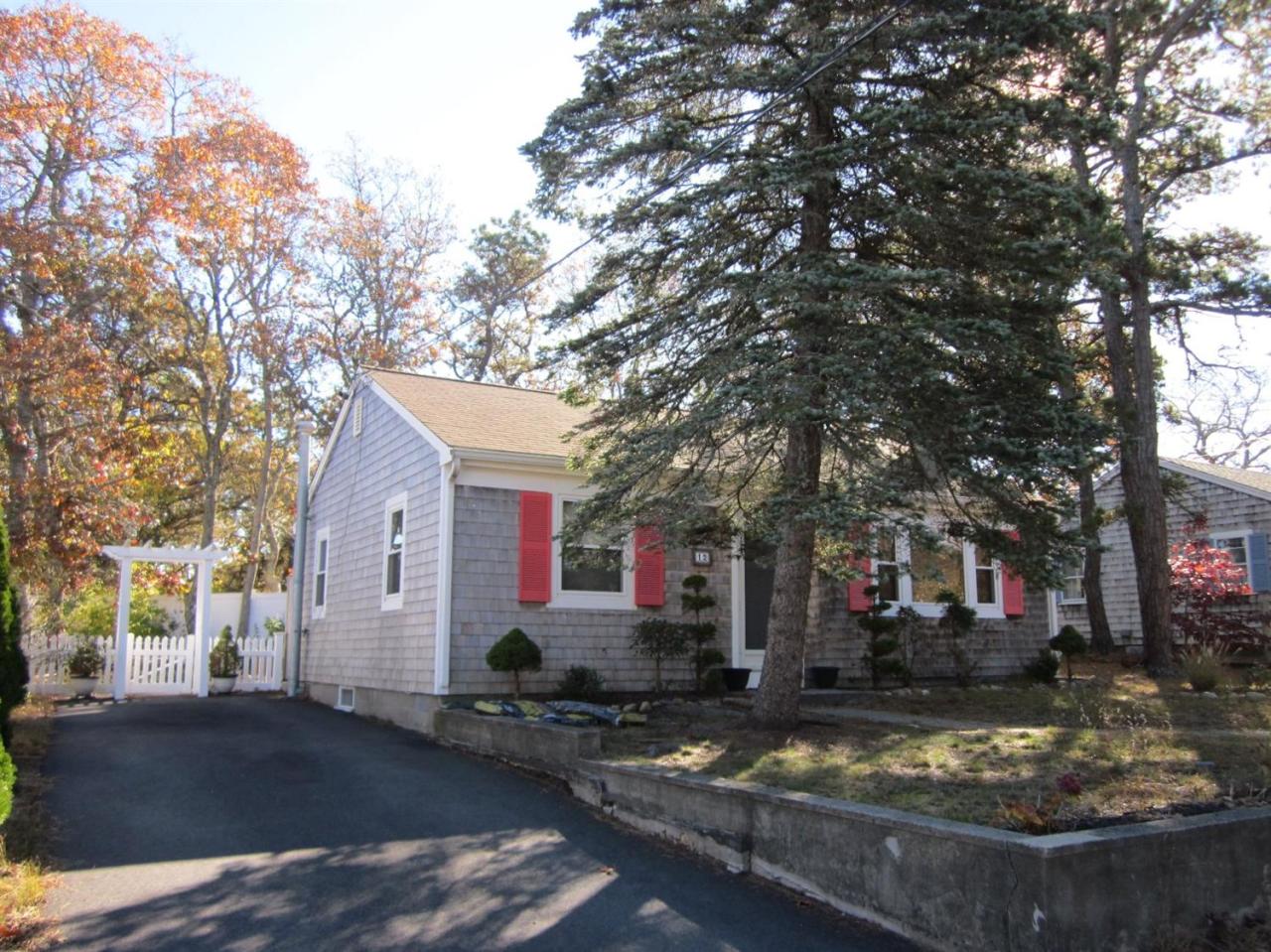 12 Captain Chase Road Dennis Port, MA 02639 - Photo 2 of 14 a view of a house with snow on the tree