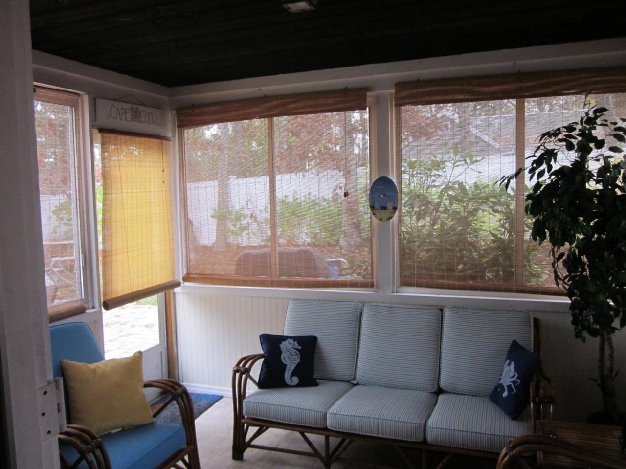12 Captain Chase Road Dennis Port, MA 02639 - Photo 8 of 14 a living room with a large window and a table