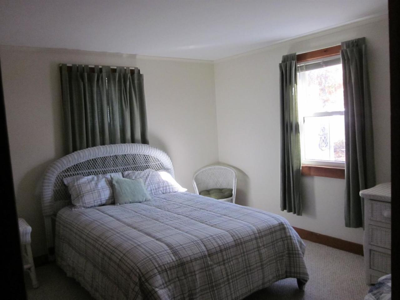 12 Captain Chase Road Dennis Port, MA 02639 - Photo 10 of 14 a bedroom with a bed and a window