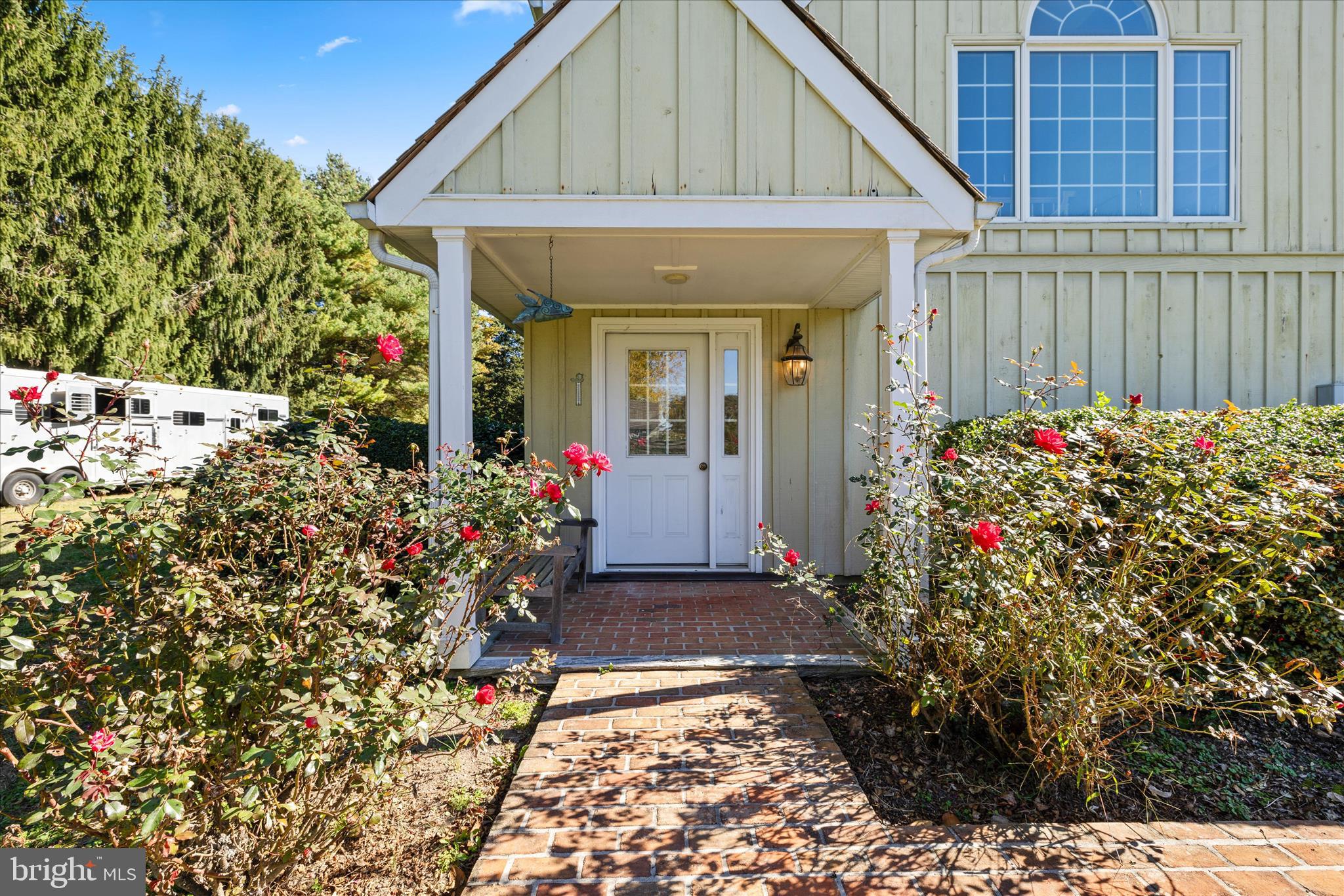 27473 Westpoint Road Easton, MD 21601 - Photo 48 of 58 a front view of a house with a flower garden